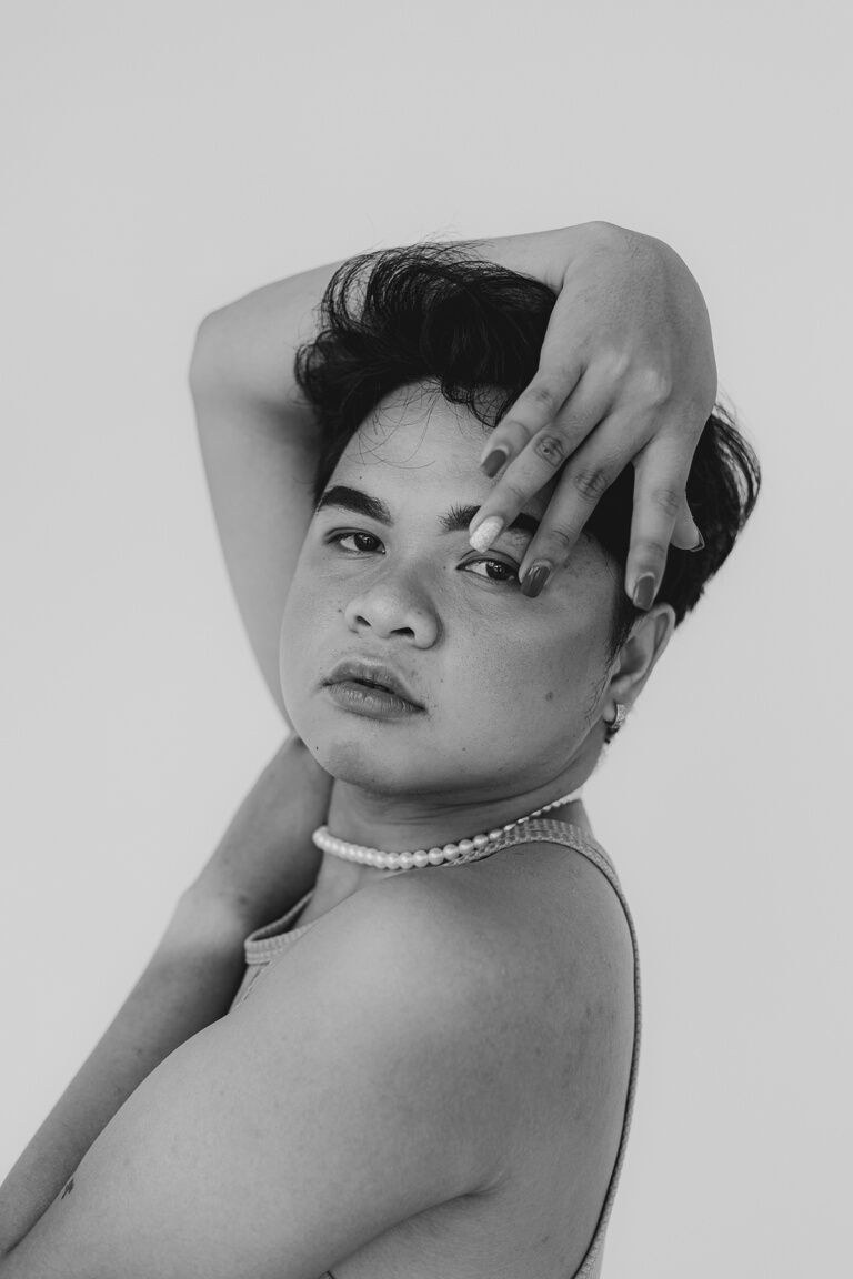 Portrait of a Young Gay Man on White Background